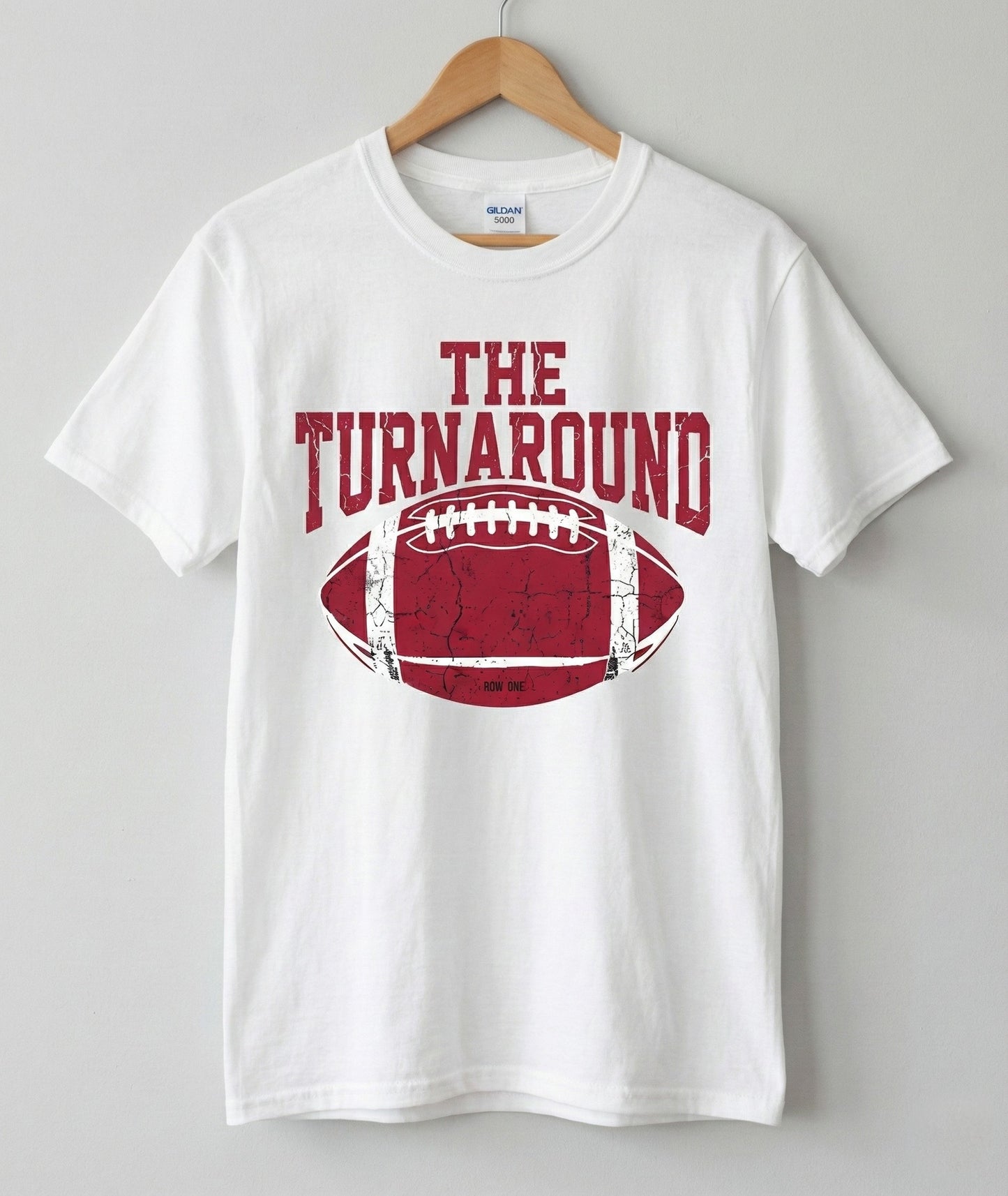 The Turnaround football tee hanging on hanger