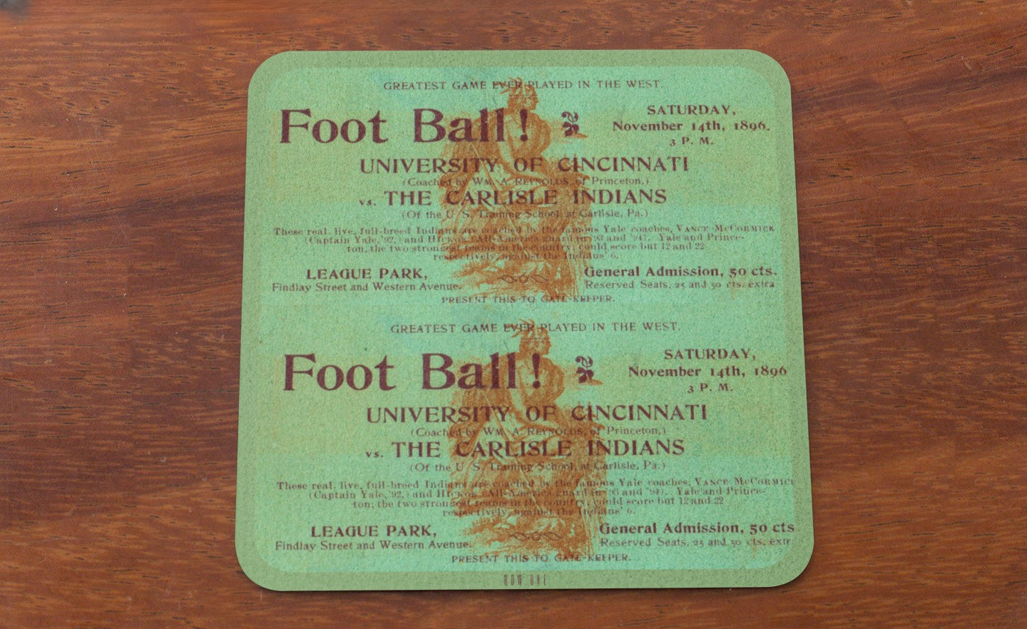 Vintage football game ticket wood coaster from the University of Cincinnati on a wooden surface