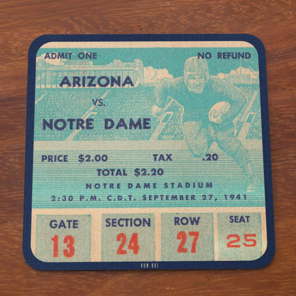 Vintage-style football game ticket for Arizona vs. Notre Dame on a wooden surface