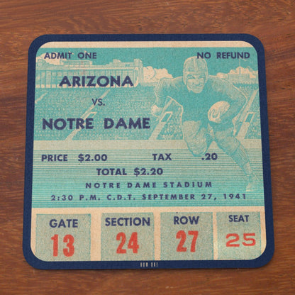 Vintage-style football game ticket for Arizona vs. Notre Dame on a wooden surface