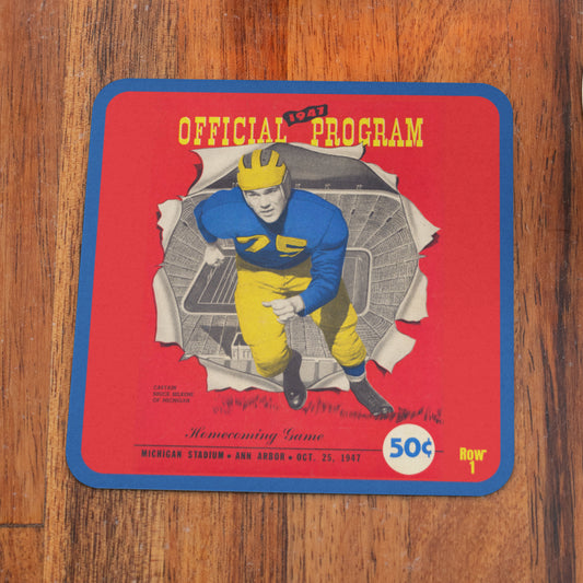 Vintage football program cover with a player illustration on a wooden surface