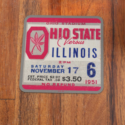 Vintage-style ticket stub for Ohio State vs Illinois game on a wooden surface