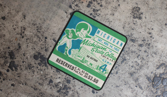 1953 Michigan Wolverines vs. Michigan State Spartans Football Ticket Drink Coasters with Cartoon Player Graphics