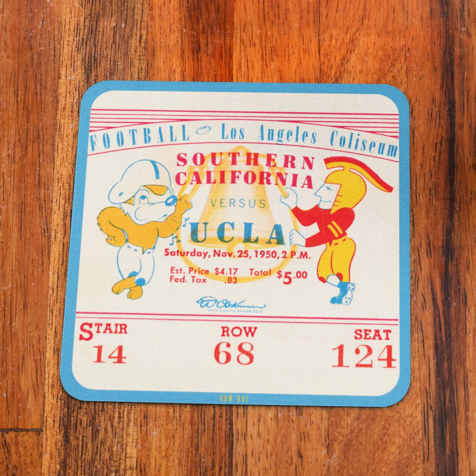 Vintage football ticket stub from Southern California vs UCLA game on a wooden surface