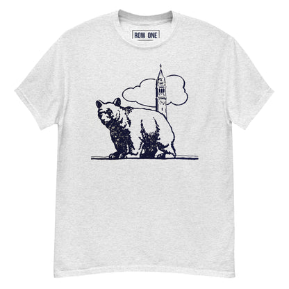 A light heather gray crewneck t-shirt featuring a dark navy blue graphic of a bear standing in front of a clock tower and clouds. The brand name 'ROW ONE' is printed inside the collar.