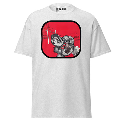A light gray heather crewneck t-shirt by ROW ONE, featuring a large graphic print on the front. The graphic shows a cartoon football player in a black and white suit holding a football, set against a vibrant red rounded square with a black border.