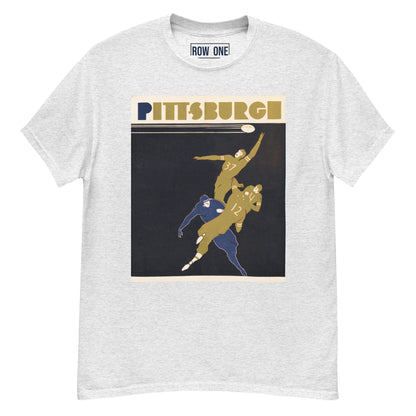 A light heather gray crewneck t-shirt featuring a vintage-style Pittsburgh sports graphic on the front. The graphic includes the word 'PITTSBURGH' in gold and navy blue above an illustration of football players in gold and navy blue on a dark background.
