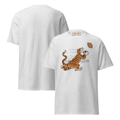 A light heather gray t-shirt shown from both front and back. The front features a cartoon graphic of an orange and black striped tiger catching a brown football, with the words 'ROW ONE' printed on the inside neck label.