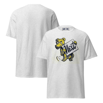 A light heather gray t-shirt shown from both front and back. The front features a cartoon graphic of a yellow and navy bear holding a sign that reads 'Next'.