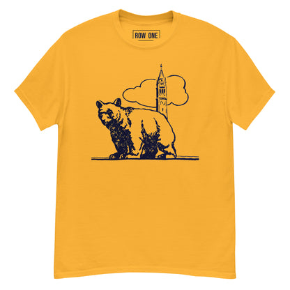 A yellow short-sleeve t-shirt with a dark navy blue graphic of a bear and a clock tower, displayed on a clean white background.