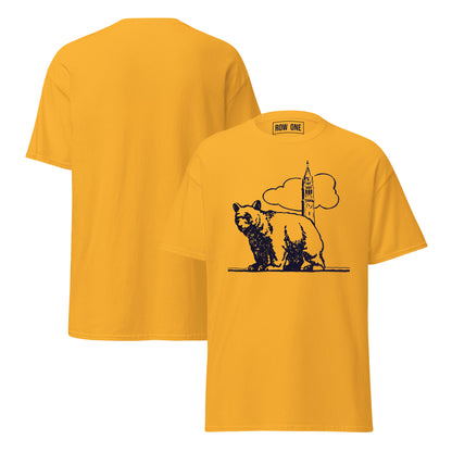 A yellow short-sleeve crewneck t-shirt shown from both front and back. The front features a black graphic of a bear walking next to a clock tower and cloud, with a visible 'ROW ONE' brand label inside the collar.