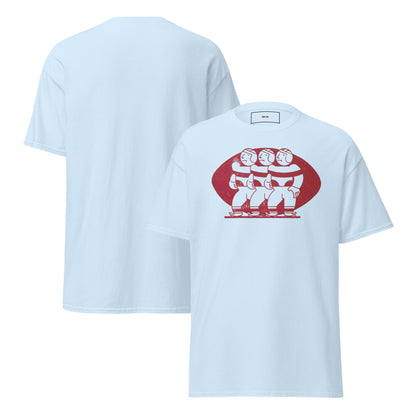 A light blue short-sleeve t-shirt shown from both the front and back. The front features a red graphic of three stylized football players inside a red oval football.