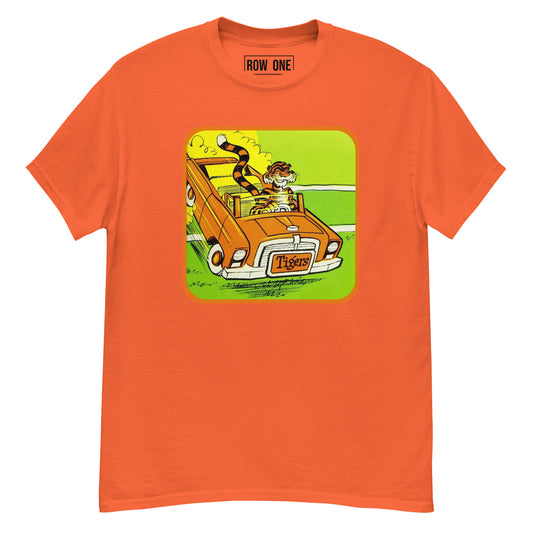 An orange crewneck t-shirt featuring a graphic print of a tiger driving an orange convertible car on a green road. The brand name 'ROW ONE' is printed inside the collar.