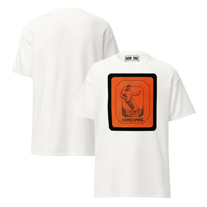 White short-sleeve t-shirt shown from both front and back. The front features a large orange and black Football 'Homecoming' graphic on the chest, and the back is plain white.