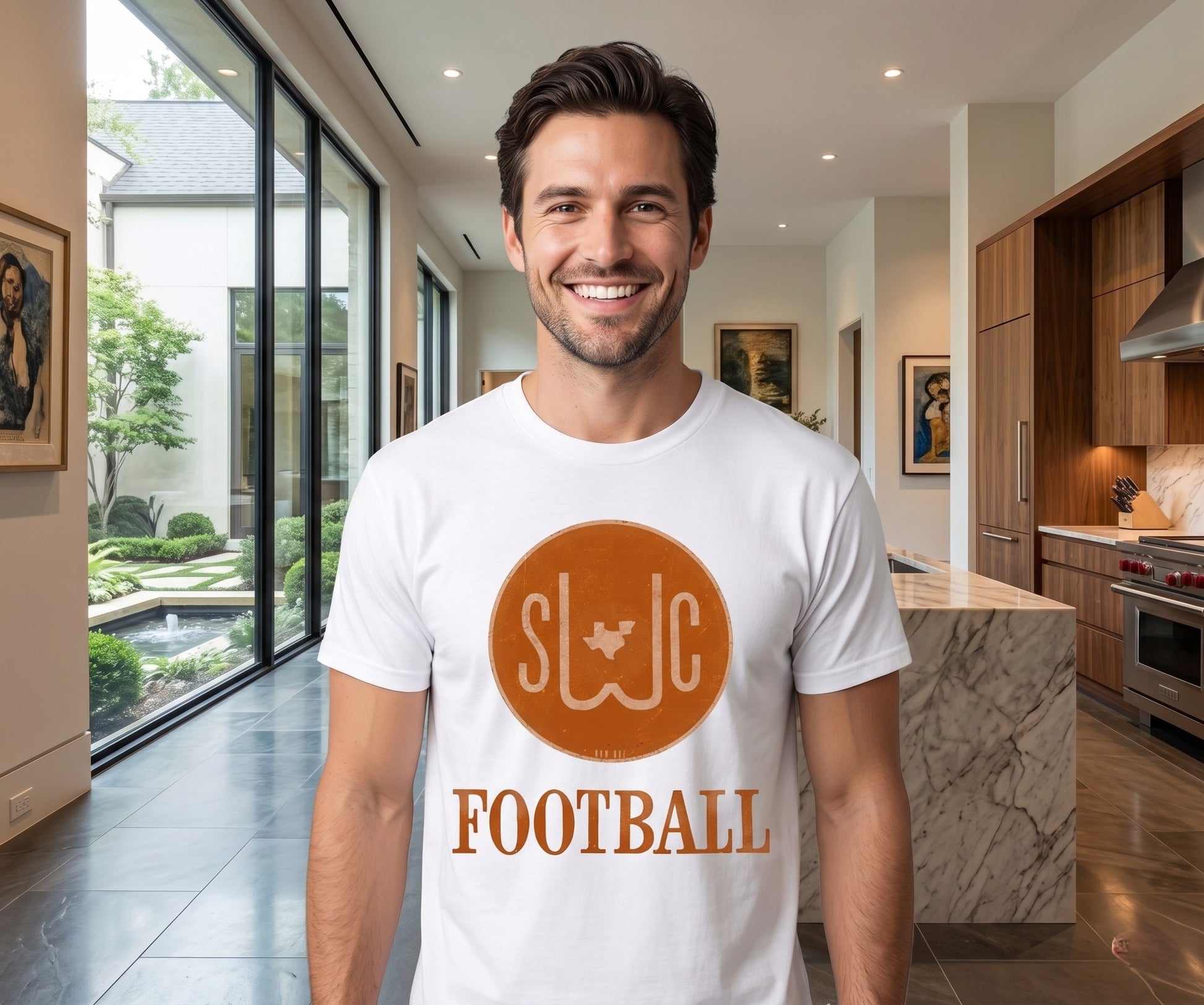 Man wearing a white t-shirt with 'SWC Football' design in a modern kitchen.