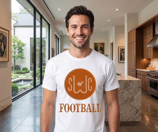 Man wearing a white t-shirt with 'SWC Football' design in a modern kitchen.
