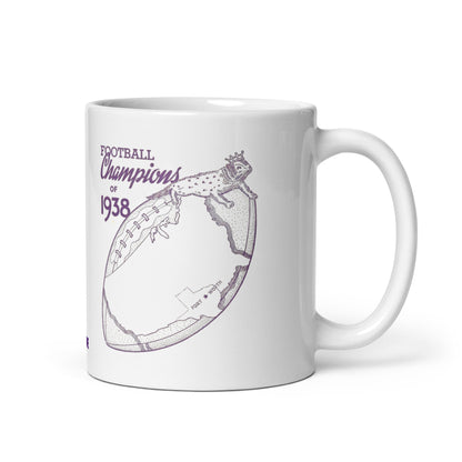 A white ceramic mug with a purple graphic print that reads 'FOOTBALL Champions of 1938' alongside a stylized football and reptile illustration, shown on a white background.