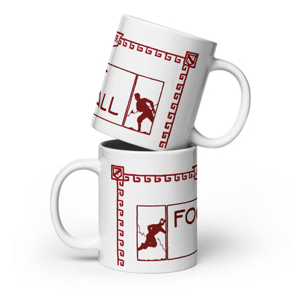 Two white ceramic mugs stacked with a red graphic print featuring a football player silhouette, Greek key border, and partial text on a white background.